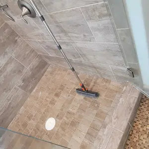 Halden brush cleaning a shower or bathroom